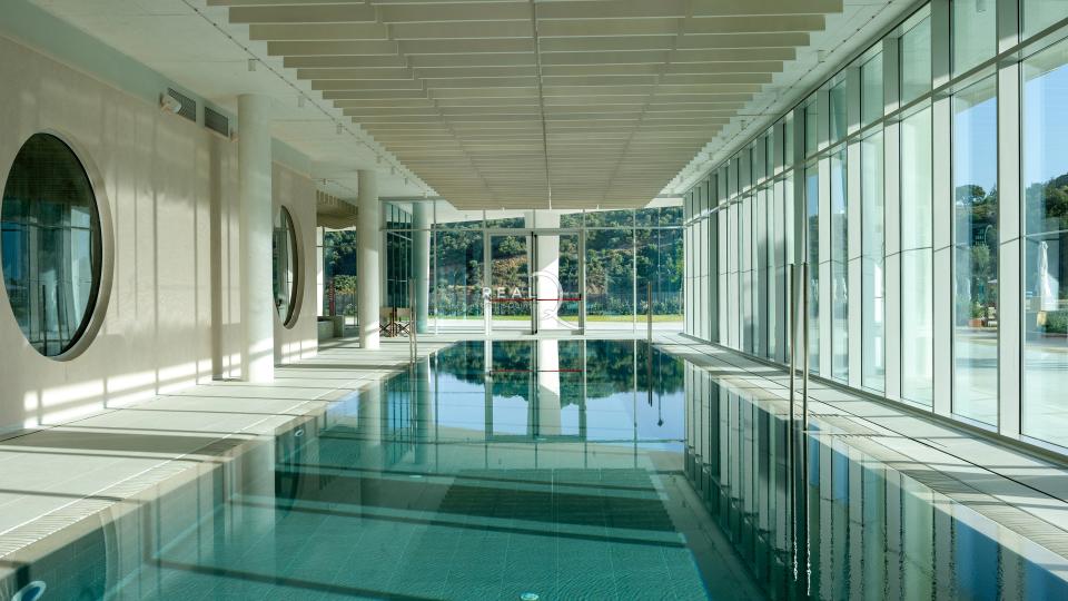 wellness center with indoor pool, sauna, gym, yoga, pilates,